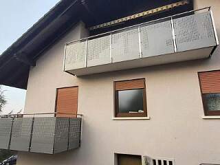 Balkongeländer aus Metall mit Lochblechfüllung | &copy;Schlosserei Schott GmbH